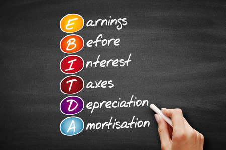 EBITDA - Earnings Before Interest, Taxes, Depreciation, Amortization acronym, business concept on blackboardの写真素材