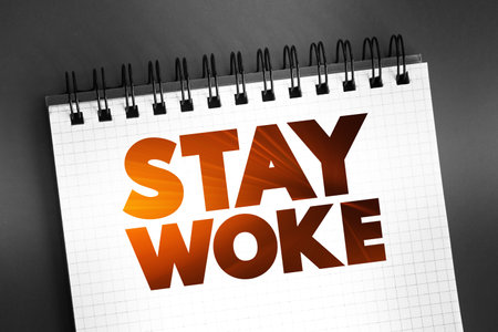 Stay Woke text on notepad, concept backgroundの写真素材