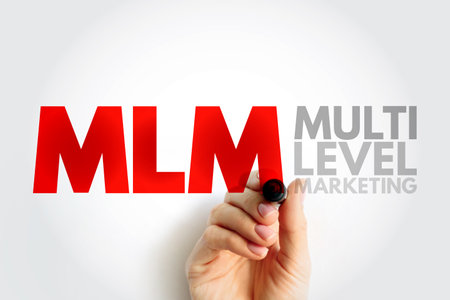 MLM Multi Level Marketing - monetary strategy used by direct sales companies to encourage existing distributors to recruit new distributors, text concept for presentations and reportsの写真素材