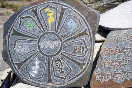 Mani stone with the inscription mantra is one of the elements of the Buddhist religionの写真素材