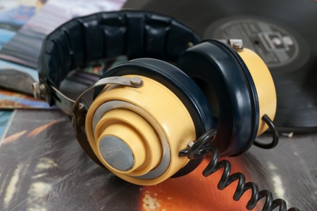 Vintage headphone and old vinyls
