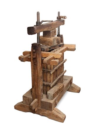 Old wine press isolated over white backgroundの写真素材