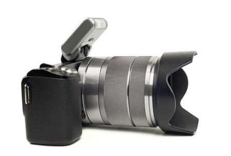 Modern mirrorless camera isolated on white