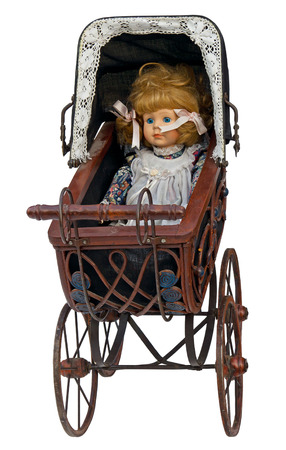 Vintage toy pram with doll isolated の写真素材