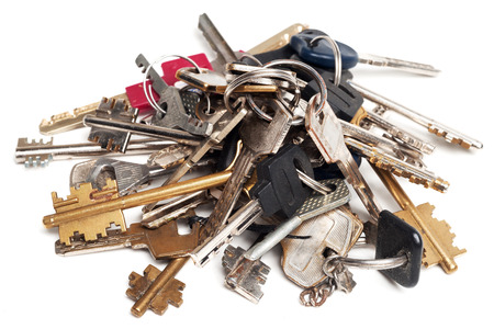 Heap of old keys isolated on whiteの写真素材