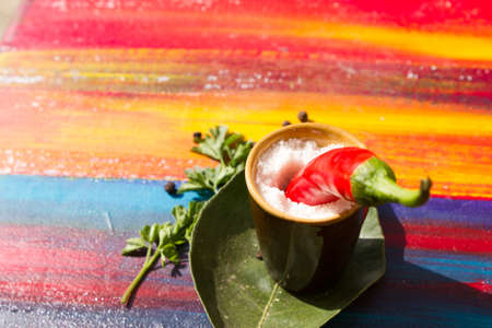 Red hot chili peppers and spices on a wooden boardの写真素材