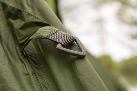 Carbine on a camp tent closeup greenの写真素材