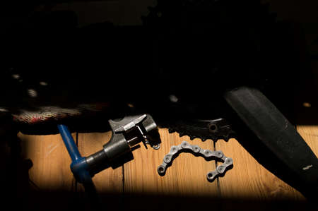 tools and parts for the repair of a bicycle in the workshopの写真素材