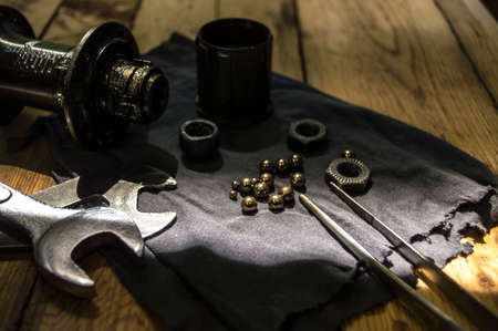 tools and parts for the repair of a bicycle in the workshop
