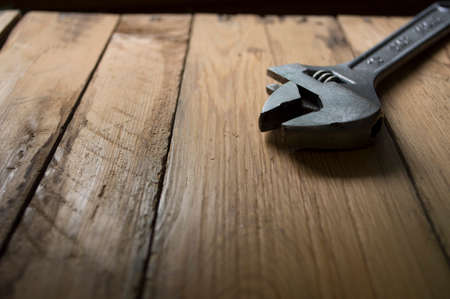 wrench on a wooden background in the workshopの写真素材