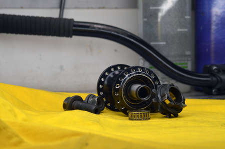 Disassembled bicycle bushing with spokes close up in the workshop