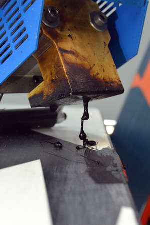 repair of ski and snowboard in the workshopの写真素材