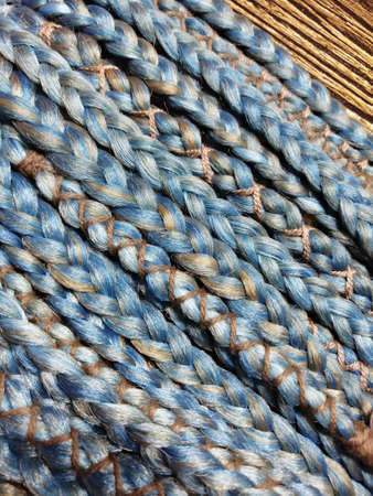 braids on a wood background at close rangeの写真素材