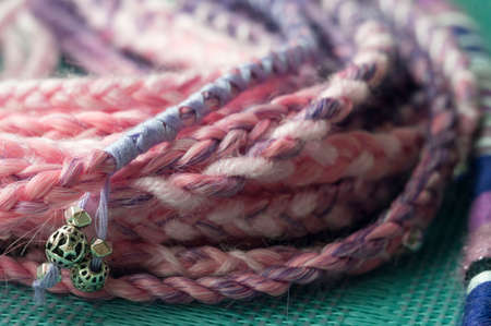 braids on a wood background at close rangeの写真素材