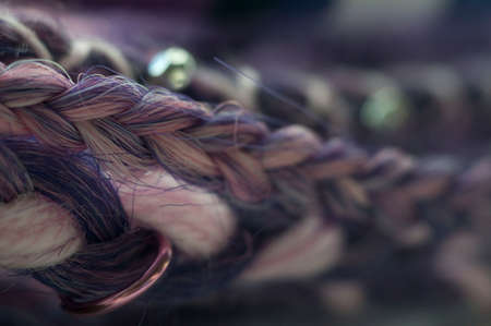 braids on a wood background at close range