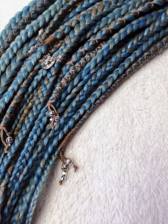 braids on a wood background at close range