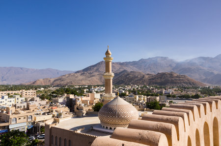 The Grand mosque and minaret in Nizwa viewed from the Nizwa fortress in Oman.のeditorial素材