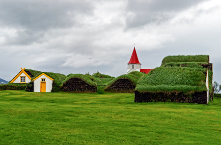 Farm Museum in Glaumbaer - Iceland. Picturesque village of old houses covered with turf and grass.のeditorial素材