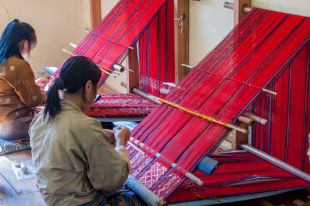 Bhutanese woman weaving - Eastern Bhutan. Women of eastern Bhutan are skilled at weaving and some of the most highly prized textiles are woven by them.のeditorial素材