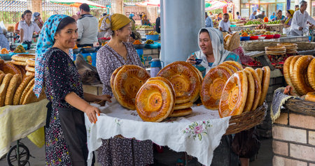 Margilan, Uzbekistan - September 13, 2013: National plain market in the market - Margilan near Fergana, Uzbekistan. There are two types of Uzbek bread: plain and festal one.のeditorial素材