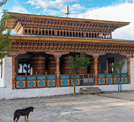 Dog in front of Prayer wheels house - Eastern Bhutanのeditorial素材