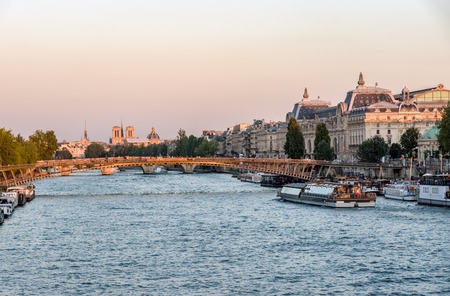 Passerelle Leopold Sedar Senghor and Musee d'Orsay at Golden Hour with Notre Dame in background - Paris, Franceの写真素材