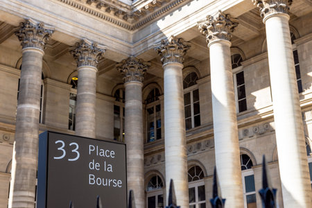 Paris, France - September 02 2019: 33 Place de la Bourse street sign with Paris Bourse stock exchange building in background.のeditorial素材