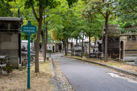 Paris, France - September 07 2019: Alley with Graves in Montmartre Cemetery on a cloudy day of september.のeditorial素材