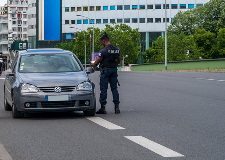 Paris, France - May 03 2020: Police control during Coronavirus Lockdown. Every citizen must have an authorization to be out of their home.のeditorial素材