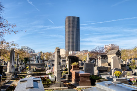 Paris, France - November 22 2019: Montparnasse Cemetery in autumn with montparnasse tower in backgroundのeditorial素材