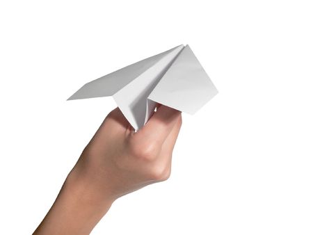 The female hand starts the paper planeの写真素材