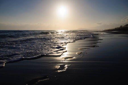 Traces on sand. Sea coast in the eveningの写真素材