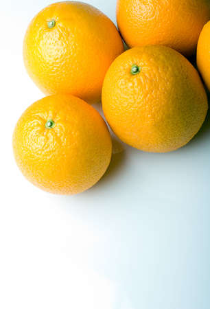 Fresh juicy oranges on a white backgroundの写真素材
