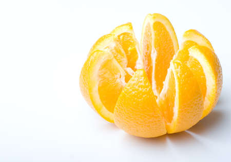 Fresh juicy ripe orange fruit cut to slicesの写真素材