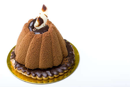 Pastry delicious chocolate mousse cake on top of a glazed cookie dessert isolatedの写真素材