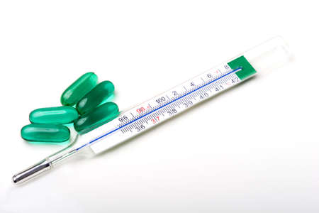 Medical object thermometer with pills for treatmentの写真素材