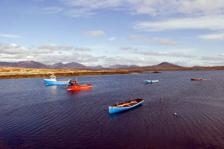 Fishing boat in a natural harborの写真素材