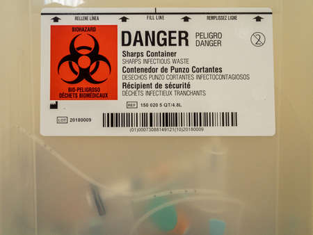 Biohazard sharps infectious waste containerの写真素材