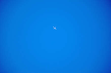 airplane in the blue skyの写真素材