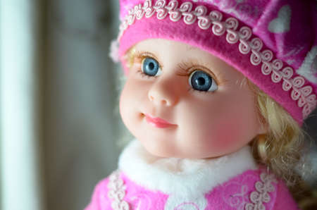 The blonde doll look up and smileの写真素材