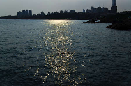 Sunset scenery in a city by the seaの写真素材