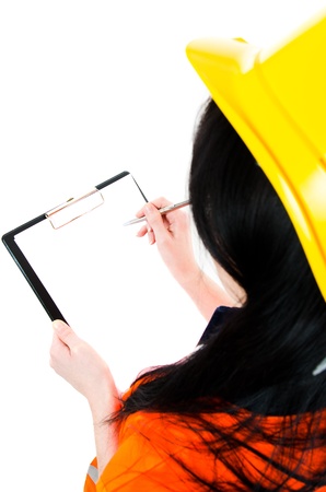 Engineer woman  taking notes in her clipboard - place for own textの写真素材