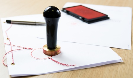 Stamp that is used by a notary public and signed documentの写真素材