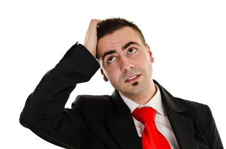 Young businessman wondering and thinking about new ideaの写真素材