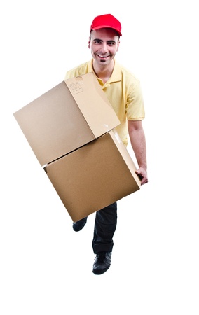 Smiling delivery man running with boxes - front view - isolated on whiteの写真素材