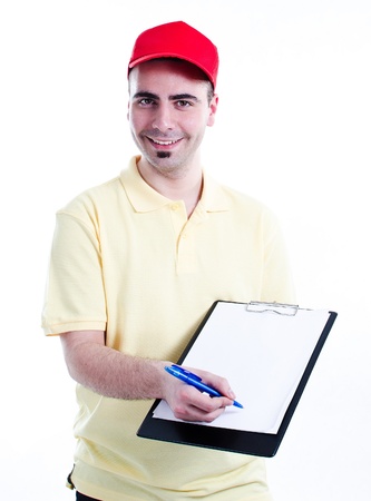 Young handsome delivery man with blank clipboard waiting for sign to delivery confirmationの写真素材