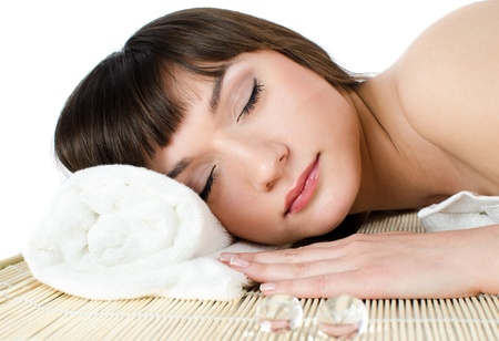 Beautiful dark-haired woman relaxes in a massage parlorの写真素材