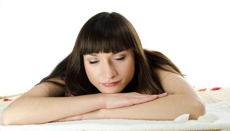 Beautiful dark-haired woman asleep in a massage parlorの写真素材
