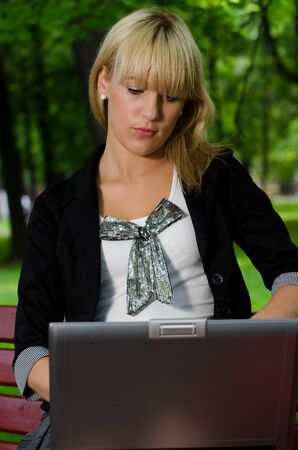 The woman with laptop on outdoorの写真素材