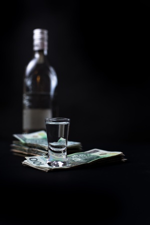 Money we spent on alcohol - black bacgroundの写真素材